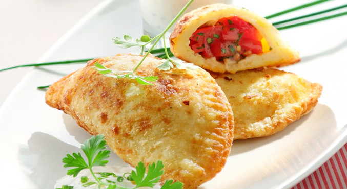 Gefüllte Pizzataschen mit Oregano-Vinaigrette